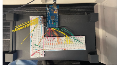 The Arduino Mega and breadboard wiring for the row/column Velostat matrix readout